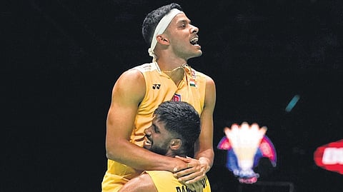India’s Satwiksairaj Rankireddy (right) and Chirag Shetty celebrate after beating South Korea’s Kang Min Hyuk and Seo Seung Jae in the men’s doubles semifinal match at Malaysia Open at Bukit Jalil Axiata Arena in Kuala Lumpur on Saturday.