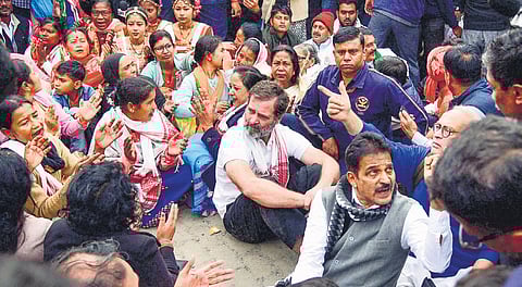 Rahul Gandhi along with party leaders and supporters sit in protest after he was not allowed to visit a monastery in Assam.
