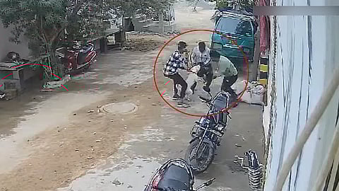 CCTV footage of people struggling to rescue the girl from the pit bull.