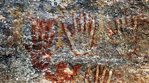 In a rare discovery, white and yellow handprints were also spotted.