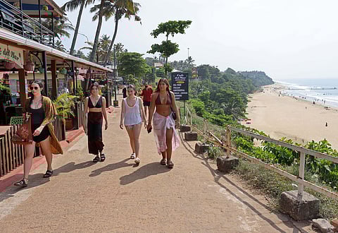Foreign tourists walking along the pathway on top of the Papanasam Cliff at Varkala in Kerala. (Representational image)