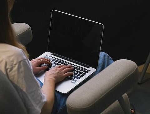 Image of a working woman used for representation al purposes only