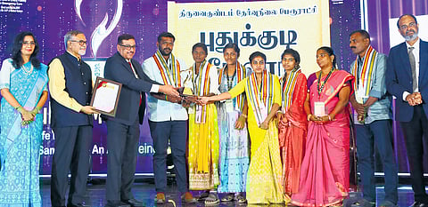 Pudukudi Melur villagers, who provided accommodation and food to the stranded train passengers at Srivaikuntam railway station, being felicitated.