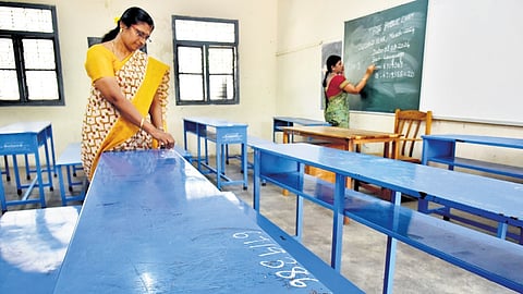 Teachers prepare a classroom at Presidency GGHSS, Chennai on Thursday