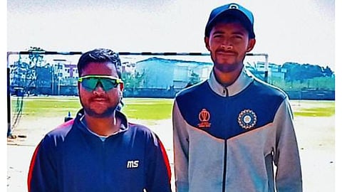 Net bowler Ritesh Keshri (R) with his coach Ashif Haque Ansari