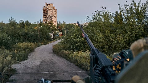 A Ukrainian soldier sits in his position in Avdiivka.