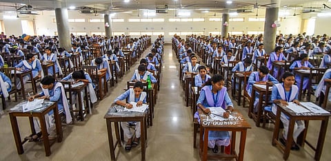 As CHSE plus two exams begins, students at an examination venue write their first paper at Ramadevi Women's University.