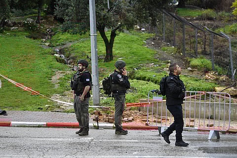 Israeli security forces examine the site hit by a rocket fired from Lebanon, in Safed, northern Israel, Wednesday, Feb. 14, 2024.