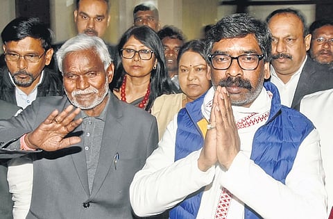 Chief Minister Champai Soren (left) and former CM Hemant Soren along with party MLAs at the House.
