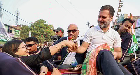 Congress leader Rahul Gandhi receives a rose from a supporter during the Bharat Jodo Nyay Yatra, in Chandauli district, Friday, Feb. 16, 2024.