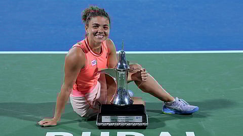 Jasmine Paolini of Italy poses for a photograph with her trophy after she beats Anna Kalinskaya during their final match of the Dubai Duty Free Tennis Championships in Dubai on Feb. 24, 2024.