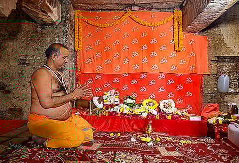 A priest performs prayers in the basement of the Gyanvapi mosque following court orders allowing the resumption of the practice.