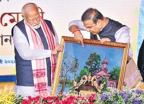 PM Narendra Modi with Assam CM Himanta Biswa Sarma during the inauguration and foundation stone laying of various projects in Guwahati on Sunday.