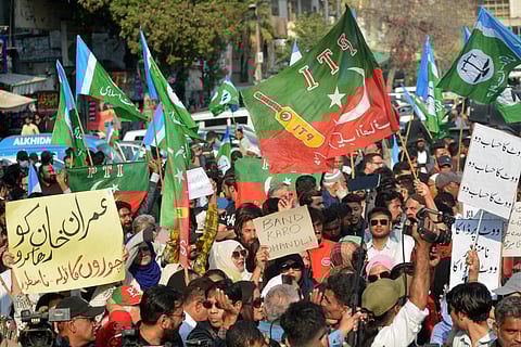 Supporters of the Pakistan Tehreek-e-Insaf (PTI) protest outside an election commission office in Karachi on February 10, 2024, amid claims the election result delay is allowing authorities to rig the vote-counting.