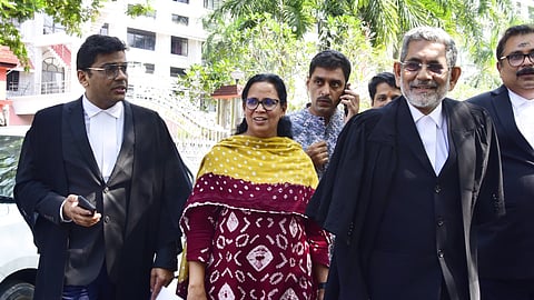 MLA K K Rema, wife of T P Chandrasekharan, coming out of the Kerala HC with special public prosecutor P Kumarankutty (second from right), lawyers S Rajeev (extreme right), Saphal Krishnan (extreme left) and others.