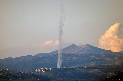 This picture taken from an Israeli position along the border with southern Lebanon shows rockets fired from Lebanon into Israel on February 26, 2024.