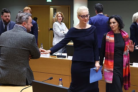 Leading Kremlin critic Alexei Navalny's widow Yulia Navalnaya (C), Luxembourg's Foreign Minister Xavier Bettel and Belgium's Foreign Minister Hadja Lahbib arrive for a meeting of European Union Foreign Ministers.