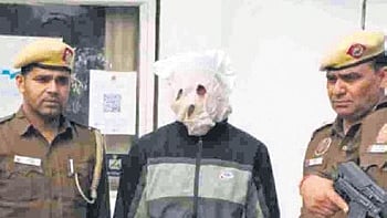 Police with the arrested member of proscribed terror outfit Lashkar-e-Taiba (LeT)