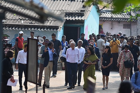 File | Tech mogul and philanthropist Bill Gates visits a slum at Niladri Vihar in Bhubaneswar to interact with community members.