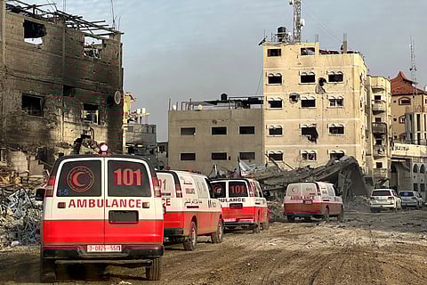 This handout photograph taken on February 18, 2024 by the World Health Organization (WHO), shows a convoy of ambulances during a WHO, UN humanitarian agency OCHA and Palestinian Red Crescent mission to evacuate patients from Nasser hospital in Khan Yunis in the southern Gaza Strip, amid ongoing fighting between Israel and the Palestinian militant group Hamas.