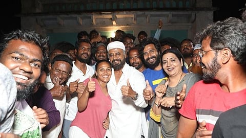 Aishwarya Rajinikanth (in center, in pink) with her father Rajinikanth (center, in white) on the sets of 'Lal Salaam'.