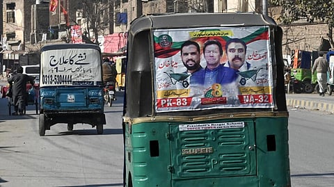 An autorickshaw with a party poster for jailed former prime minister Imran Khan in Peshawar, a day after Pakistan's election.