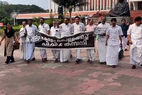The opposition entered the well with placards and later shifted their protest outside the assembly.