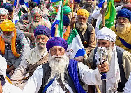 Farmers at Punjab-Haryana Shambhu border during their 'Delhi Chalo' protest, near Patiala district.