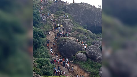 File - Image of devotees returning after worship at Velliangiri Hills, Coimbatore.