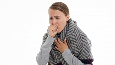 Image of a woman coughing used for representational purposes only.