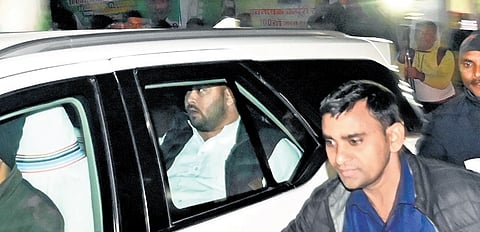 RJD leader Tejashwi Yadav leaves after an alliance meeting in Patna on Saturday.