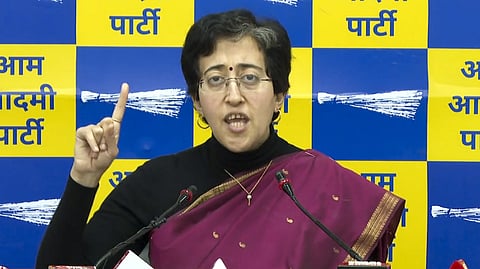 Delhi Minister Atishi addresses a press conference, in New Delhi.