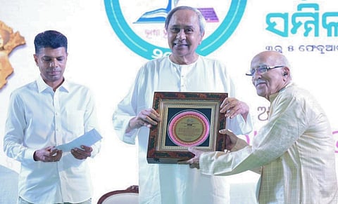 Chief Minister Naveen Patnaik conferring the first World Odia Language award on eminent linguist and scholar Debi Prasanna Pattanayak for his lifelong dedication to the development of the Odia language. Also seen is 5T Chairman VK Pandian.