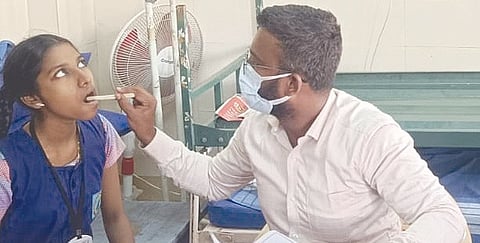 A school student being screened for malocclusion