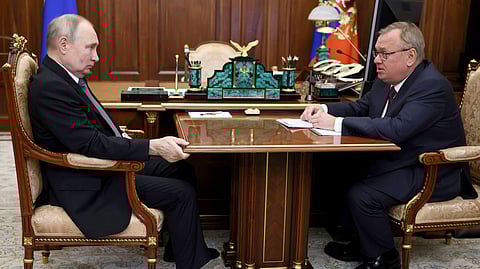 Russian President Vladimir Putin, left, listens to VTB Bank Chairman Andrei Kostin during their meeting in Moscow.