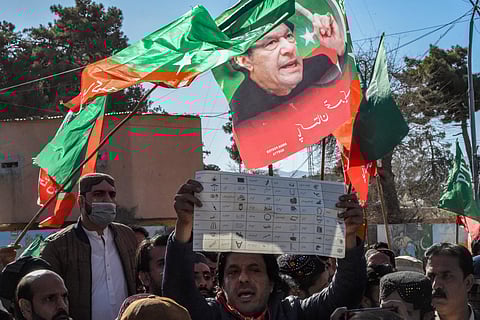 Supporters of Pakistan Tehreek-e-Insaf (PTI) and other parties protest outside the office of a Returning Officer in Quetta on February 9, 2024, against the alleged rigging in Pakistan's national election results.