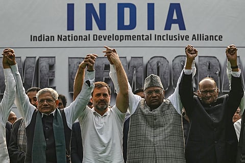 Congress leader Rahul Gandhi (2L) and AICC president Mallikarjun Kharge (2R) along with other members of the INDIA alliance, take part in a protest in New Delhi on December 22, 2023.
