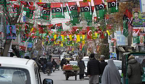 This photo taken on February 3, 2024, shows a street festooned with flags of political parties ahead of Pakistan's national elections, in Quetta.