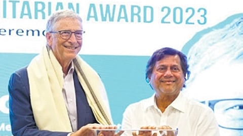 Co-founder of Microsoft Bill Gates receiving KISS Humanitarian Award from KISS and KIIT founder Achyuta Samanta