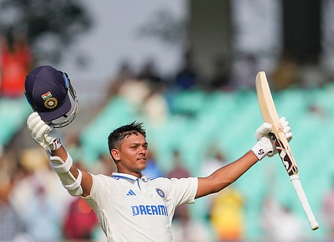 Yashaswi Jaiswal celebrates after scoring a century on the third day of the third Test between India and England at Rajkot (Photo | PTI)