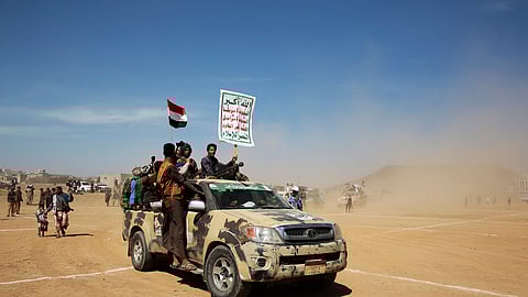 Houthi fighters stage a rally in support of the Palestinians in the Gaza Strip and against the U.S.-led airstrikes on Yemen, in Sanaa, Yemen.