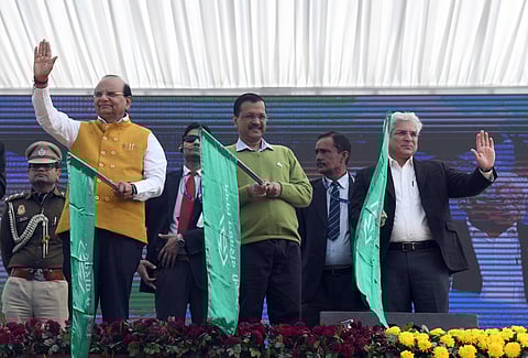 Delhi Lieutenant Governor Vinai Kumar Saxena along with CM Arvind Kejriwal and Transport Minister Kailash Gahlot flag off 350 electric buses, at Bansera in New Delhi on Wednesday.
