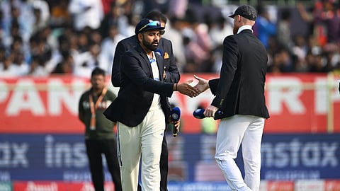 India's captain Rohit Sharma and England's captain Ben Stokes (R) shake hands during the toss prior to the start on the first day of the second Test cricket match between India and England at the Dr. Y.S. Rajasekhara Reddy cricket stadium in Visakhapatnam on February 2, 2024.
