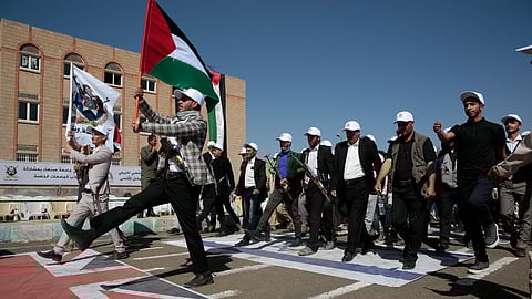 Newly recruited Houthi fighters attend a protest march against the US-led strikes on Yemen and the Israeli war in the Gaza Strip, Wednesday, Feb. 21, 2024, in Sanaa, Yemen.