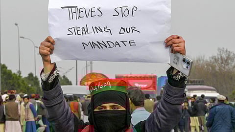 Supporters of Khan's Pakistan Tehreek-e-Insaf (PTI) party block the Peshawar-Islambad highway as they protest against the alleged skewing in Pakistan's national election results in Peshawar on February 12, 2024.