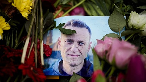 Rain drops cover a portrait of Russian opposition leader Alexei Navalny in front of the Russian Embassy in Berlin, Feb 21, 2024.