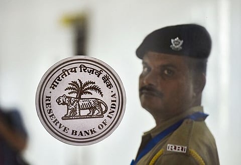 A security personnel stands guard during the RBI's bi-monthly policy review meeting, in Mumbai.