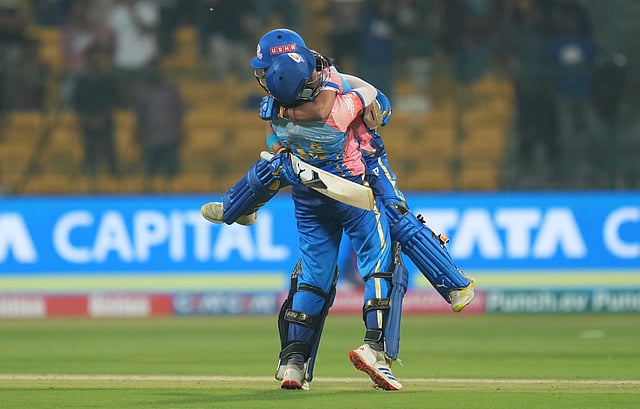 Mumbai Indians batters Sajeevan Sajana and Amanjot Kaur celebrate the WPL 2024 match over Delhi Capitals, at the M Chinnaswamy Stadium in Bengaluru.