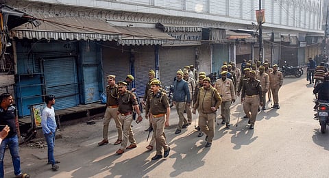 Security personnel conduct a flag march during 'Varanasi bandh' called by the Muslim community after a Varanasi court granted permission for puja in the 'Vyas ji ka Tehkhana' of the Gyanvapi Mosque, in Varanasi, Friday, Feb. 2, 2024.