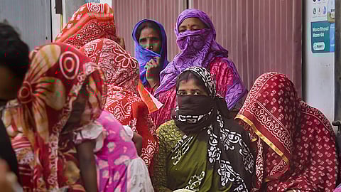 Sandeshkhali women wait to meet a National Commission for Women (NCW) representative